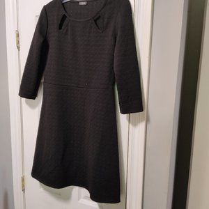 Clientele mini dress, black in color with criss cross design